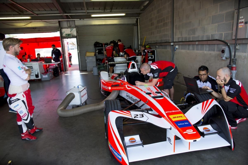 Nick-Heidfeld-Standing-Next-To-Mahindra-Garage-Donington