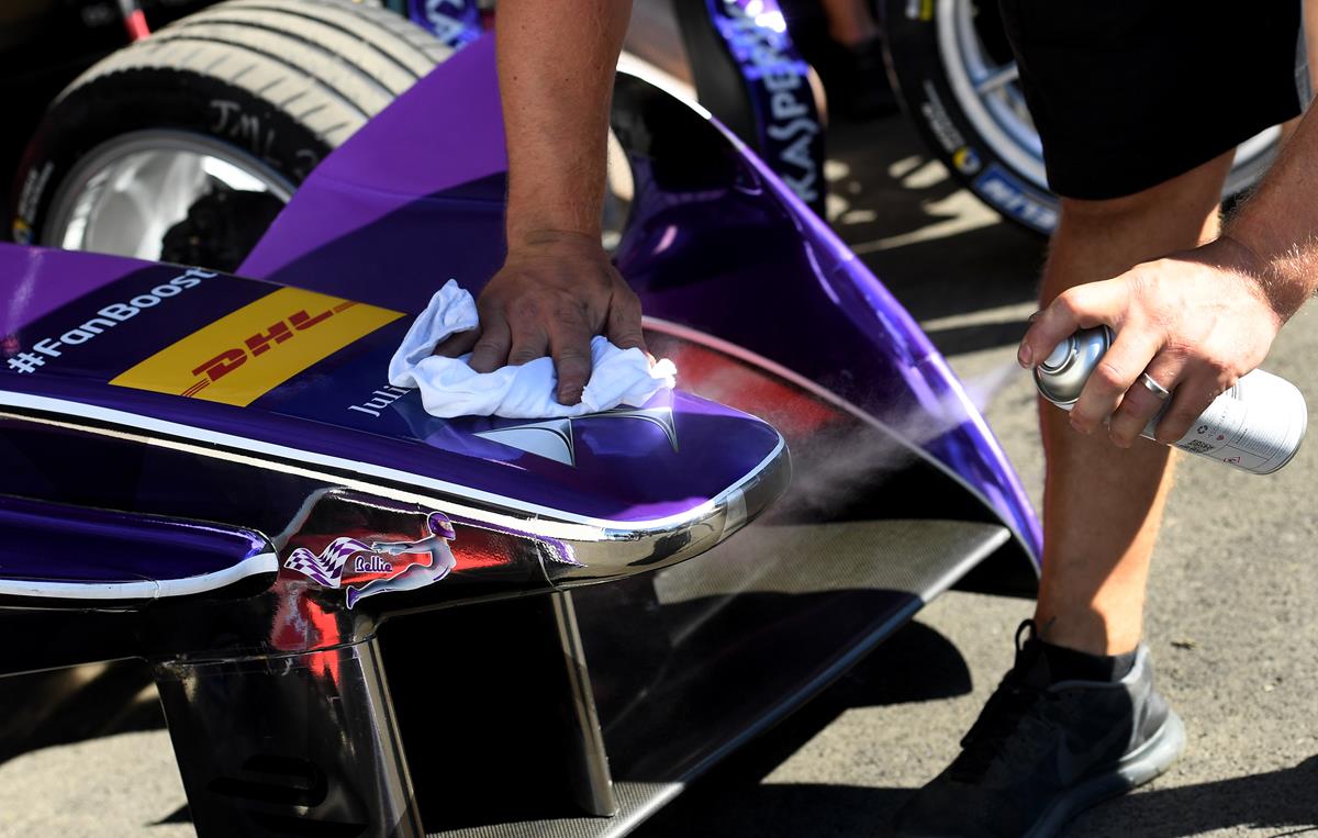 Virgin-mechanic-polishes-DS-Logo-on-Formula-E-car