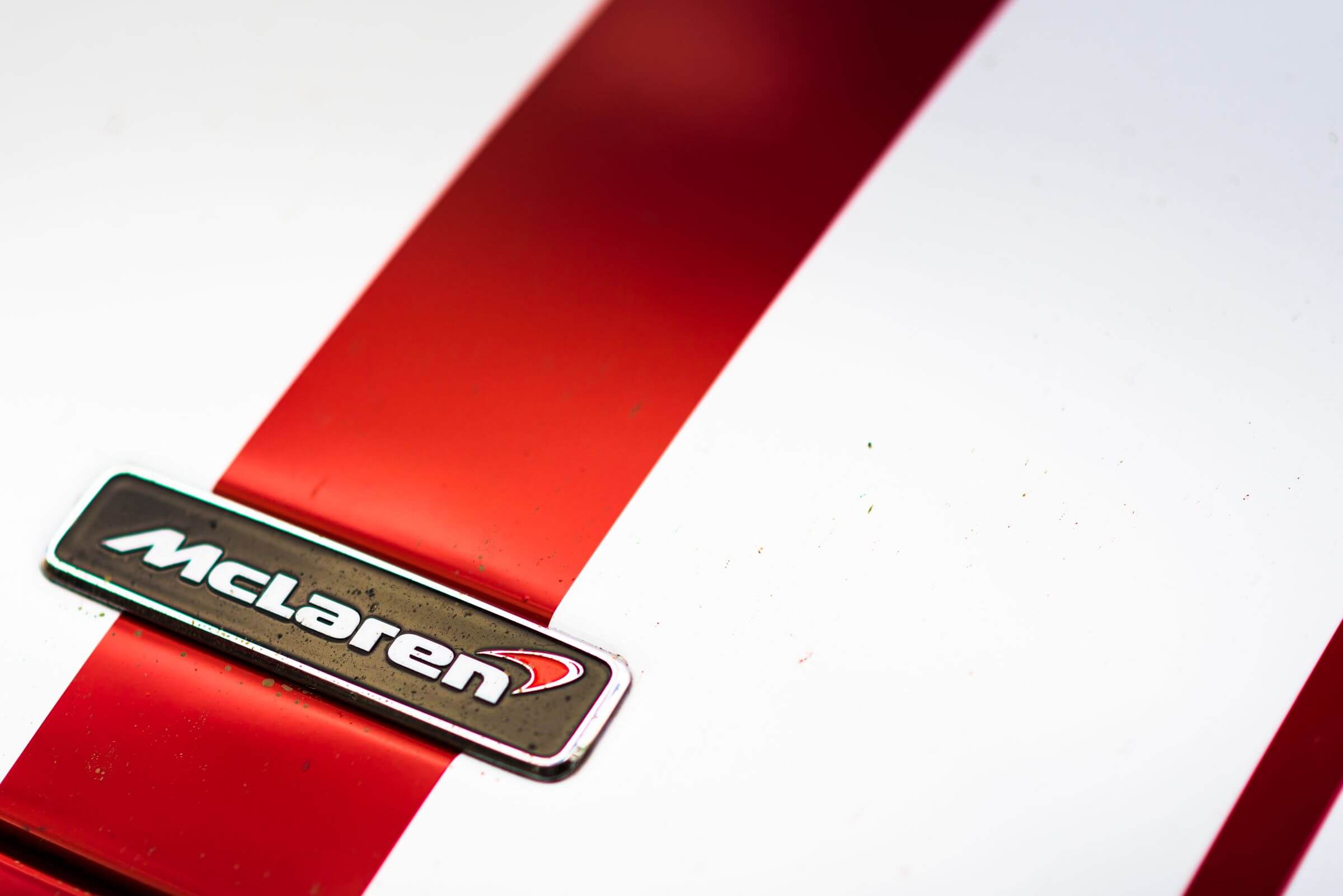 McLaren-Logo-on-red-and-yellow-background