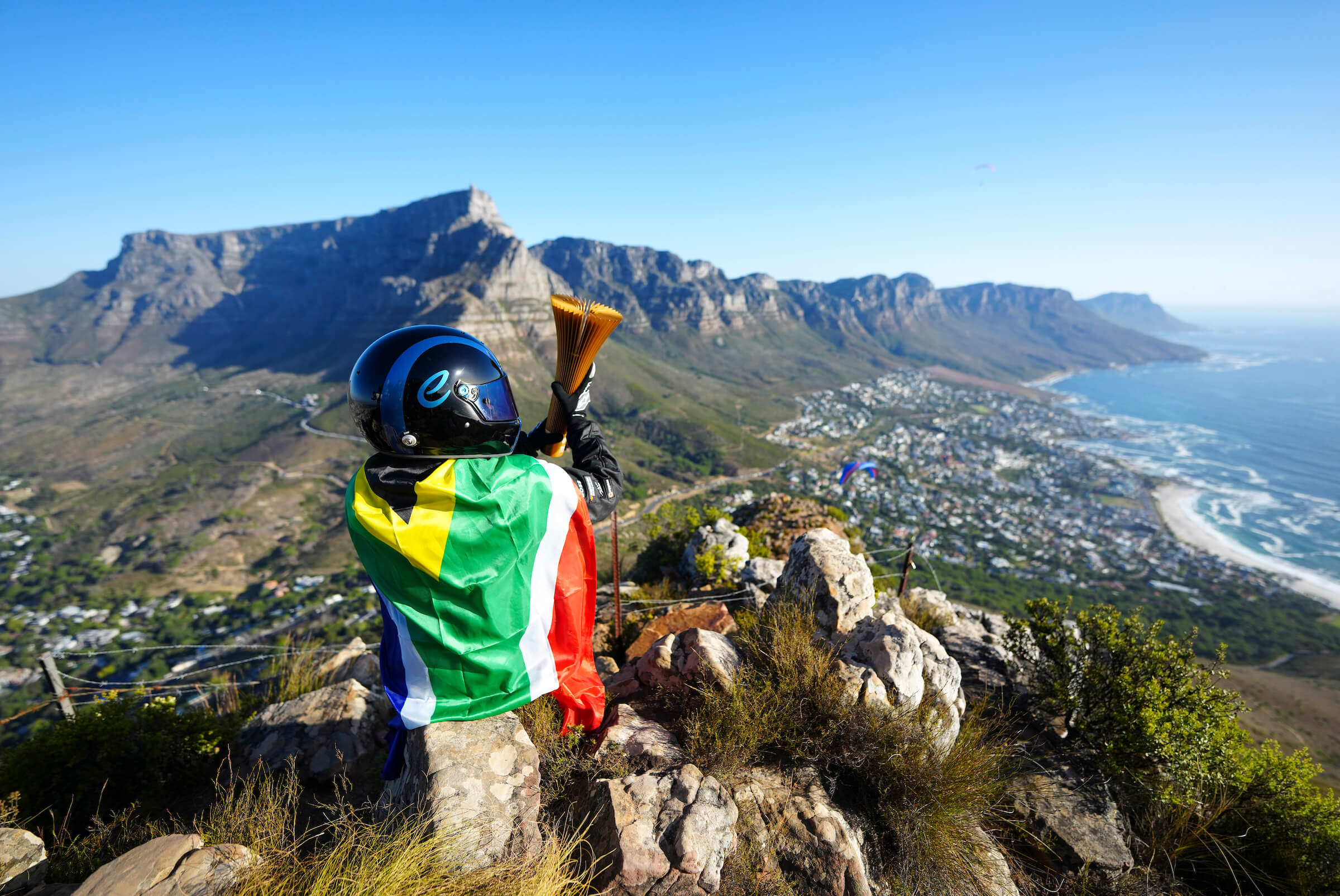 Racing-Driver-over-Capetown-with-Formula-E-Trophy-and-South-African-Flag