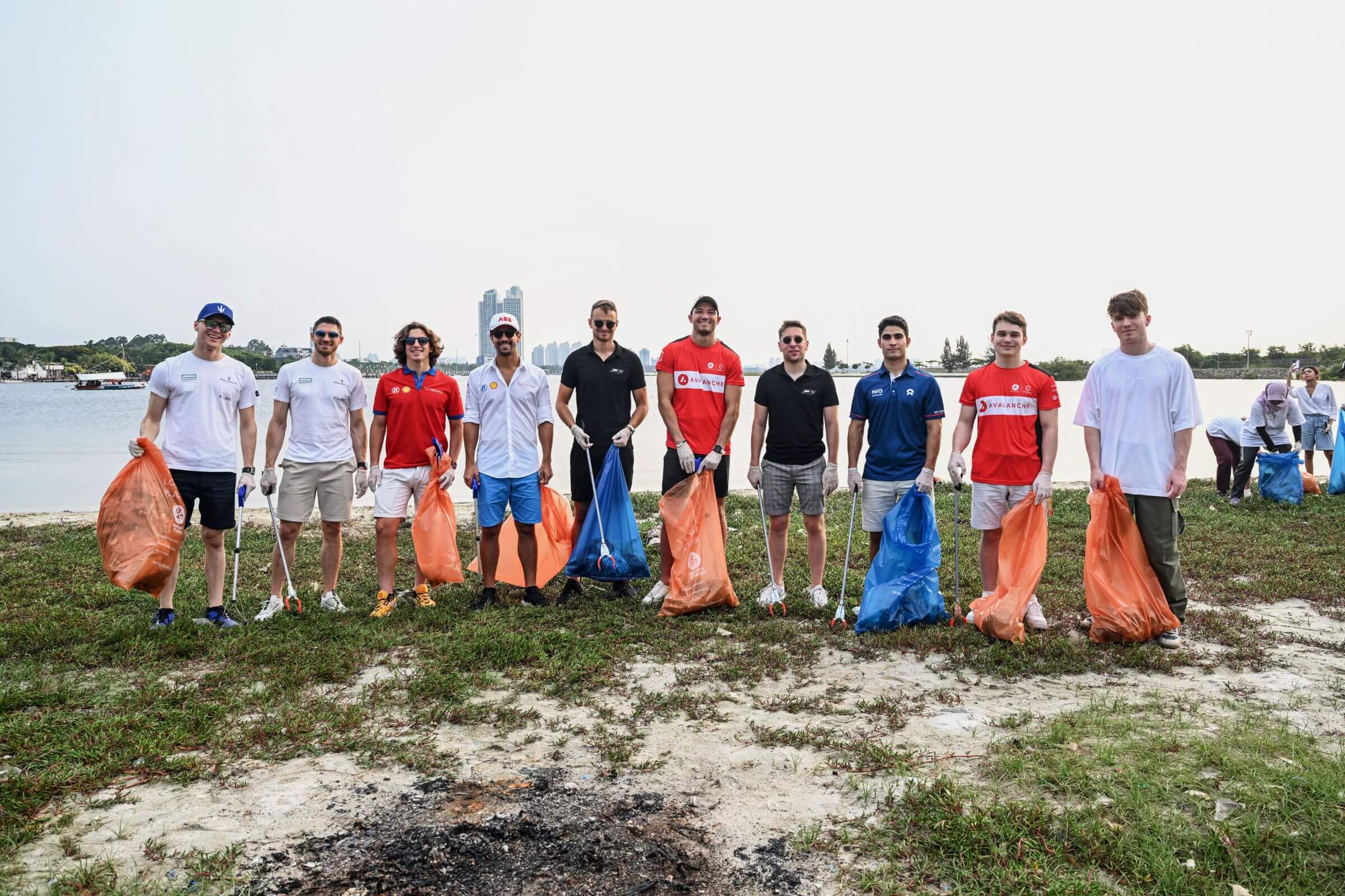 Formula-E-Drivers-collect-garbage-in-Jakarta