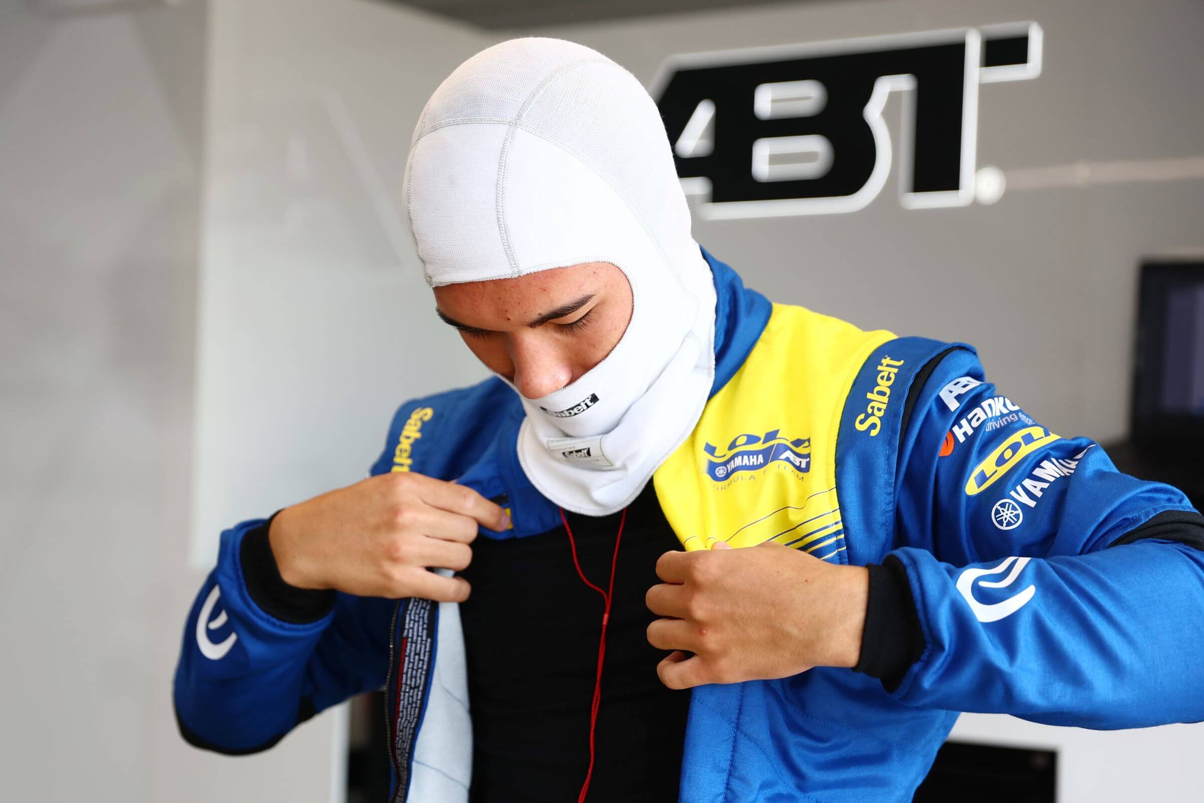 Hugh-Barter-Lola-Yamaha-ABT-2025-Berlin-E-Prix-Rookie-Test-preparing-for-getting-in-the-car