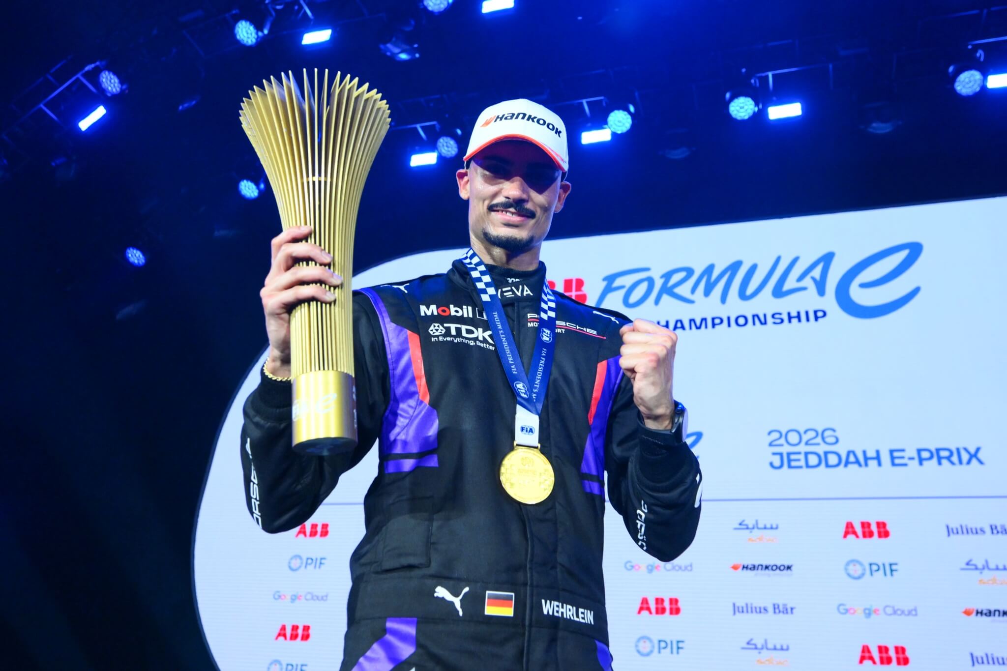 Pascal-Wehrlein-Porsche-2026-Jeddah-E-Prix-Friday-podium-with-trophy