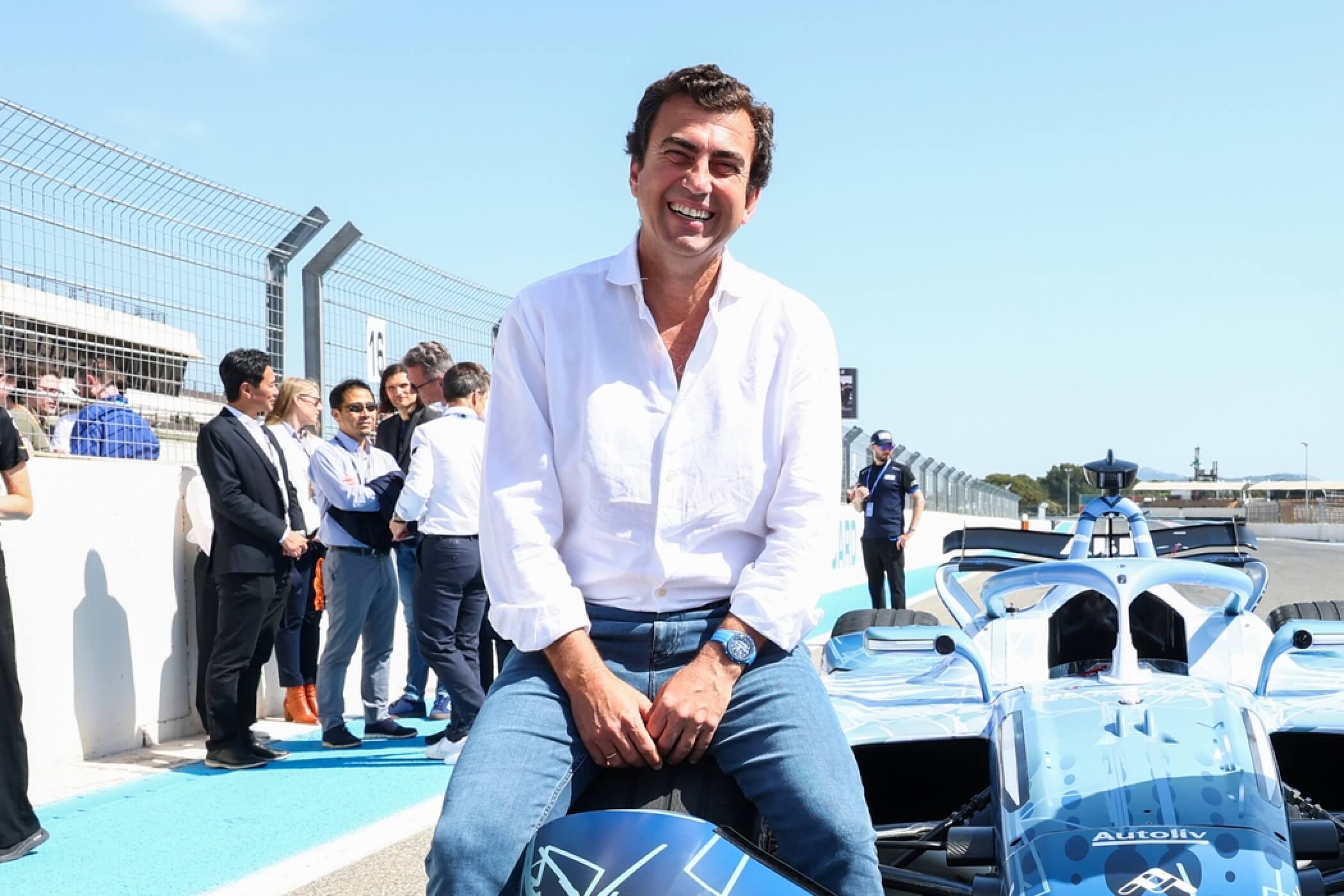 Alberto-Longo-FIA-Formula-E-Gen4-Launch-Paul-Ricard-sitting-on-the-tyre-of-the-gen4-car