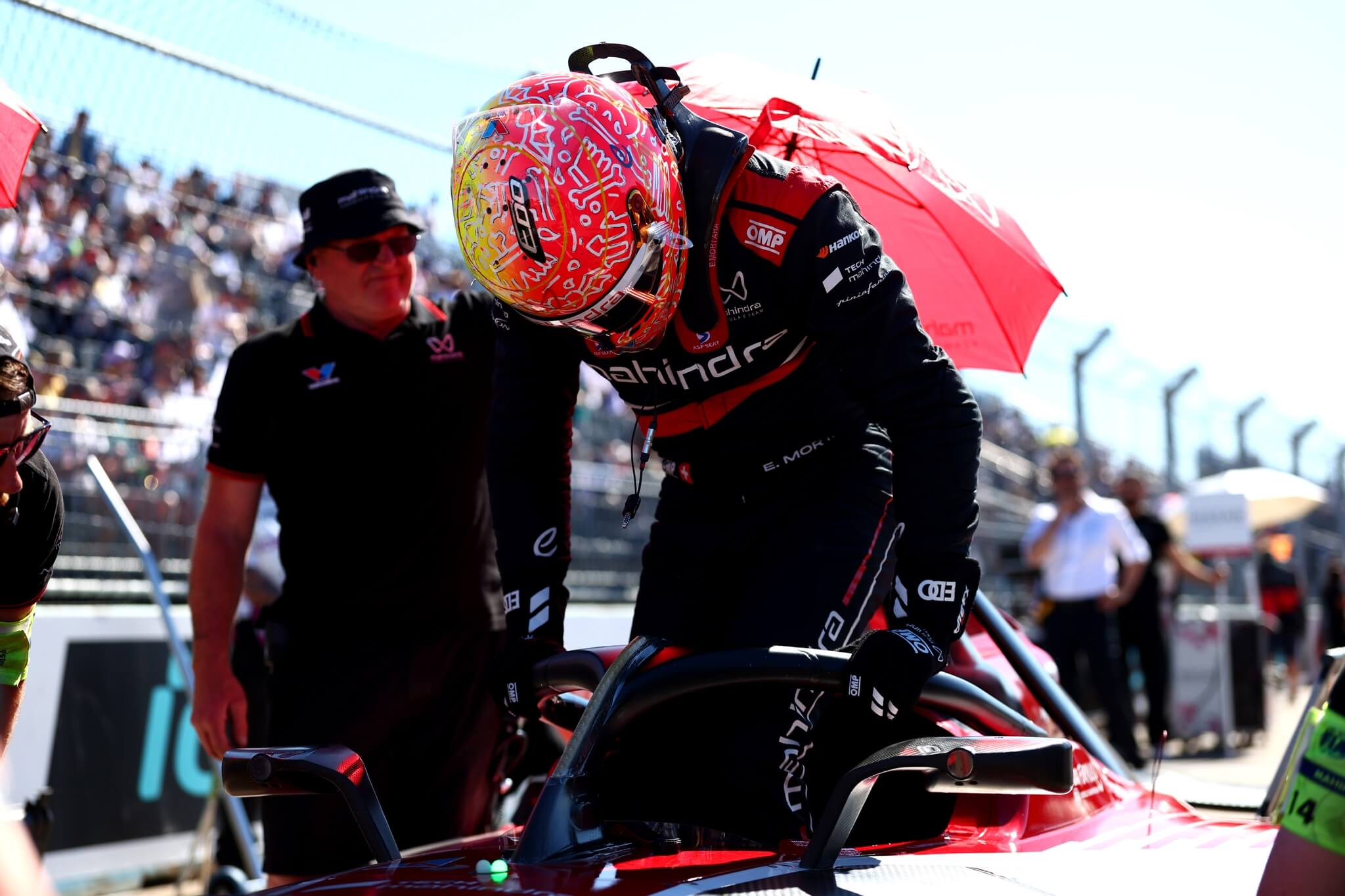 Edo-Mortara-Mahindra-Racing-2026-Berlin-E-Prix-climbing-into-the-car