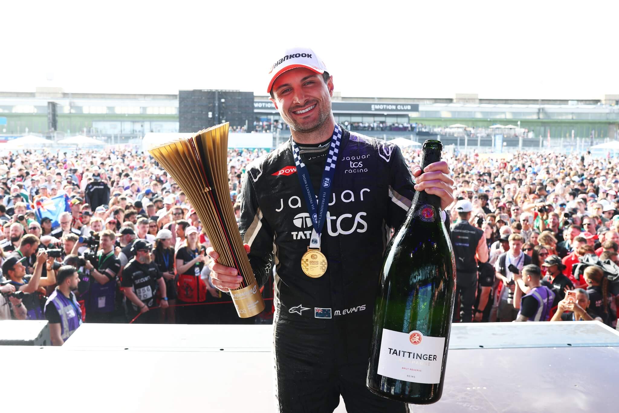 Mitch-Evans-Jaguar-TCS-Racing-2026-Berlin-E-Prix-podium-trophy-champagne