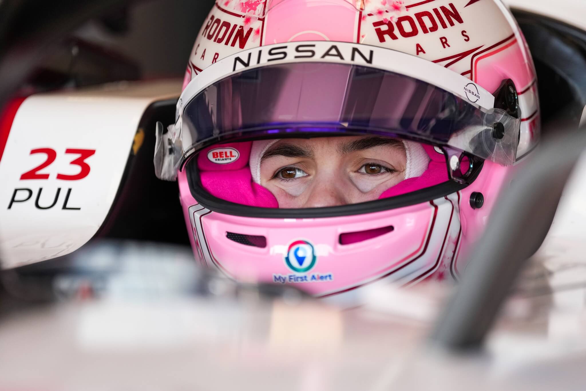 Abbi-Pulling-Nissan-Rookie-Test-Jarama-Madrid-2026-sitting-in-the-car-helmet-visor-open