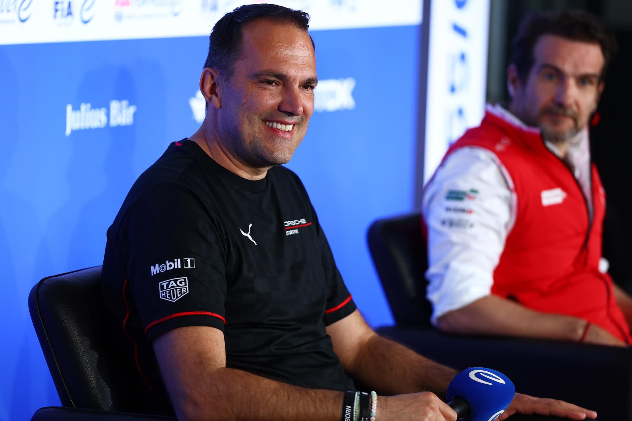 Florian-Modlinger-Porsche-2026-Berlin-E-Prix-Press-conference-with-microphone-Tomasso-Volpe-Nissan-in-the-background